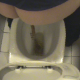 A woman is video-recorded shitting while sitting on a toilet from a perspective above the toilet. Over 3 minutes.